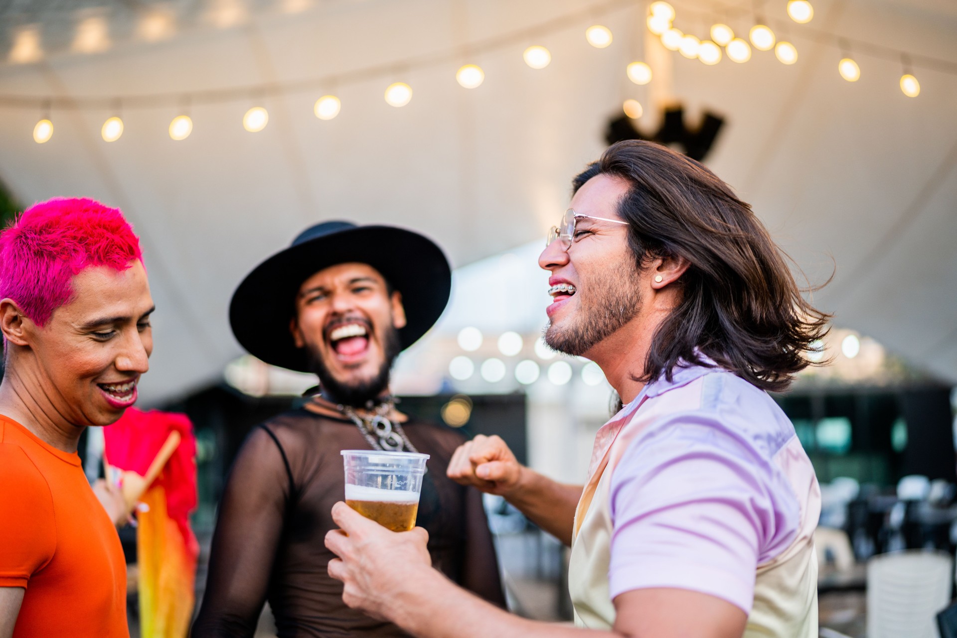 Mid adult friends dancing on a gay festival